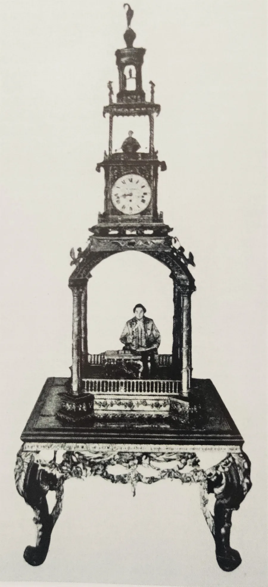 Calligrapher automaton — a Chinese figure with a brush tracing characters, a Western mechanism (Williamson clock, London), found in Peking (plate, Palace Museum catalogue, Peiping, 1933).